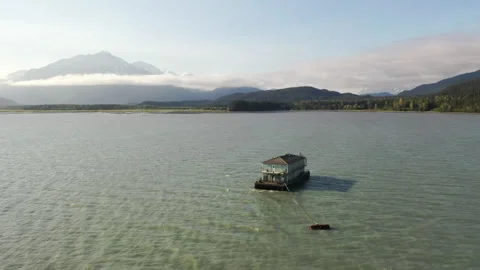 Barge mobile float camp on an inlet on the Kenai Peninsula Stock Footage 240170434