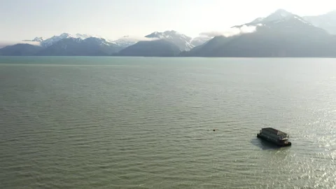 Barge mobile float camp on an inlet on the Kenai Peninsula Stock Footage 240175193