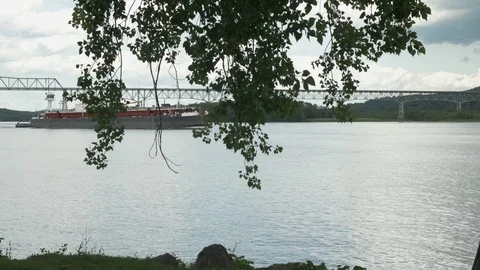 Barge Moving on Hudson River With Bridge in Background Stock Footage 77476973