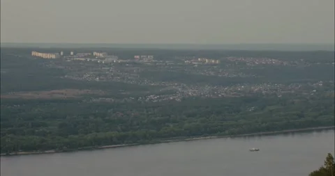 Barge navigating Volga river near Samara, Russia during hazy day Stock Footage 307810954