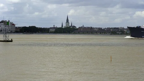 A barge passes in front of Saint Louis Cathedral in New Orleans Stock Footage 108247592