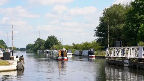 Barge passing the swing bridge at Saul Junction Sharpness - Gloucester Canal Stock Footage 114647941