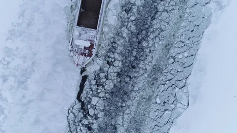 Barge passing through icy waters Stock Footage 103411575