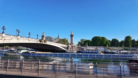 Barge passing under Pont Alexandre III bridge on Seine river in Paris, France Stock Footage 336900319