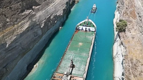 A barge pulls a bulk carrier in the Corinth Canal. Stock Footage 119269986