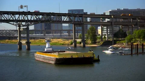 Barge Pushed Down Willamette River by Tugboat in Portland, Oregon Stock Footage 52076251