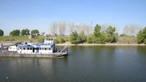 Barge pusher ship or tug boat sails empty on river going for a barge to hook up Stock Footage 152945729
