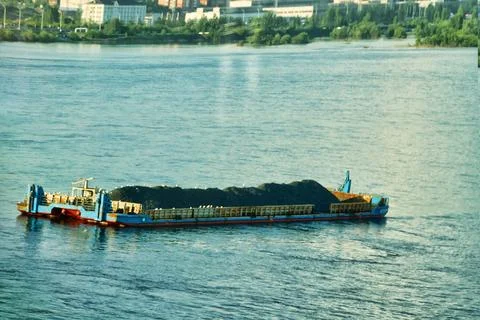 A barge with rubble is anchored Stock-Fotos