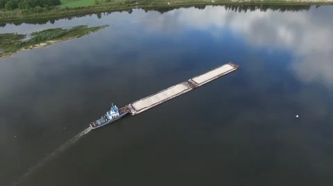 The barge with rubble floats on the river. Video stock 63832462