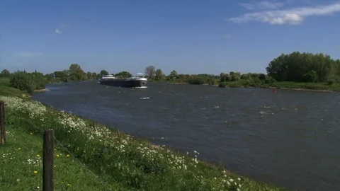 Barge sailing downstream the river IJssel, The Netherlands Video stock 107356821