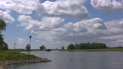 Barge sailing downstream the winding river IJssel, The Netherlands Stock Footage 130645638
