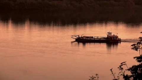 Barge sails in the evening on the river Stock Footage 133504724