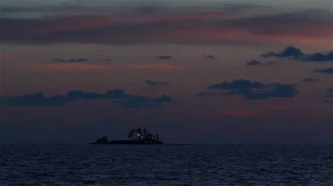 Barge ship at sea with sunset backdrop Video stock 41580747