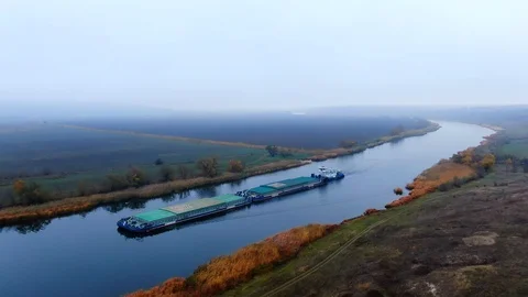 Barge towing two barge loaded by grain on the river Southern Bug. Stock Footage 121395176