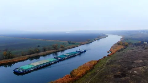 Barge towing two barge loaded by grain on the river Southern Bug. Stock Footage 121396860
