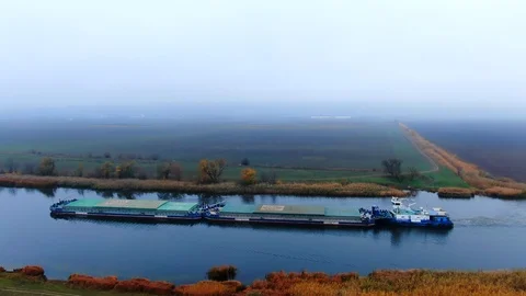 Barge towing two barge loaded by grain on the river Southern Bug. Stock Footage 121405977