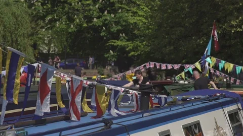 Barges with flags and canal life Stock Footage 93200321