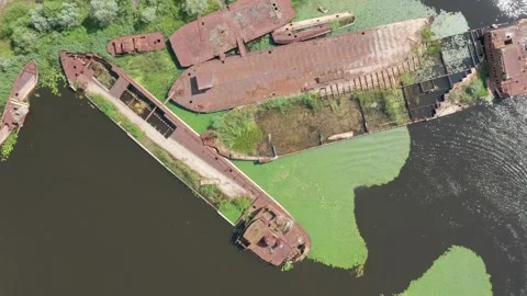 Barges lying submerged beneath the river's waters Stock Footage 261551408
