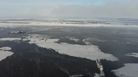 Barges sail on the sea in winter. Видео 148159075