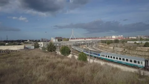 Bari, rail track pass through under suspended bridge Stock Footage 124902321