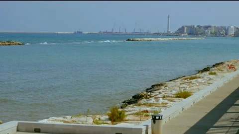 Bari seafront in Fesca a quiet summer day. In the background the lighthouse o Stock Footage 139701384