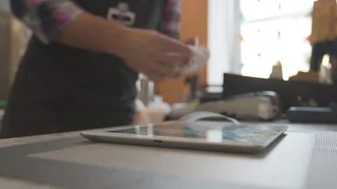 Barista are using a digital tablet Stock Footage 91034815