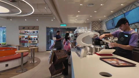 Barista at The Coffee Bean &amp; Tea Leaf Cafe Preparing Drinks Stock Footage 289105446