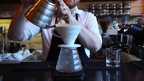 Barista doing second pour over V60 alternative coffee brew style Video stock 85617384