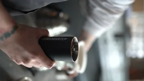 Barista grinds coffee beans before brewing coffee Stock Footage 181189889