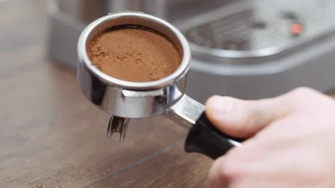 Barista hand tamping fresh ground coffee. Making coffee process. Stock Footage 112681753