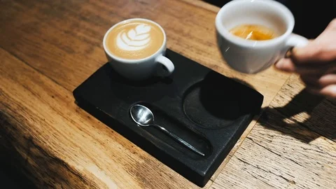 Barista hands coffee to a waitress Stock Footage 124148454