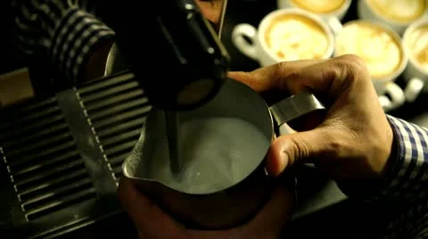 Barista heating up milk from above Stock Footage 22255886