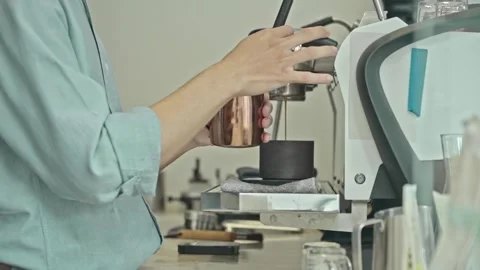 Barista holding pitcher making coffee at coffee shop with coffee machine Vídeo Stock 278314830