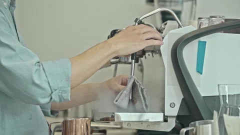 Barista holding pitcher making coffee at coffee shop with coffee machine Video stock 278314831