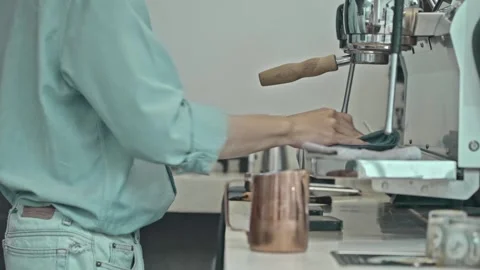 Barista holding pitcher making coffee at coffee shop with coffee machine Video stock 278314833