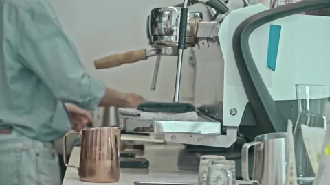 Barista holding pitcher making coffee at coffee shop with coffee machine Stock-Footage 278314852