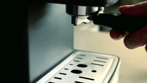 Barista inserts tray ground coffee into coffee machine. Pouring stream coffee Stock Footage 202221267