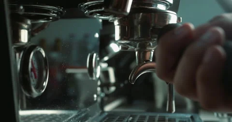 Barista inserts tray ground coffee into coffee machine. Pouring stream coffee Stock Footage 236424081