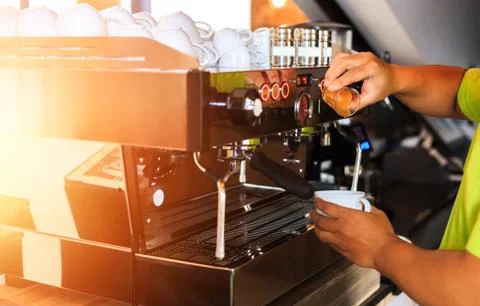 The barista make coffee in shop. Stock Photos
