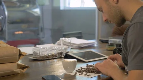 Barista makes a blend of coffee. Stock Footage 82307625