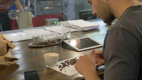 Barista makes a blend of coffee. Stock Footage 82307848