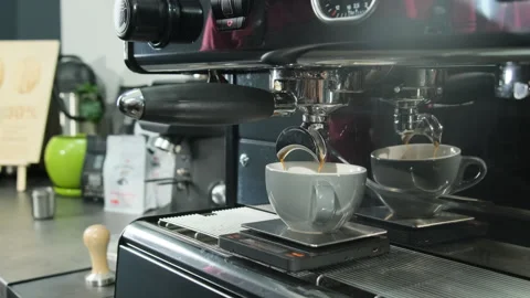 Barista makes coffee in mug using coffee machine at workspace Video stock 306620231