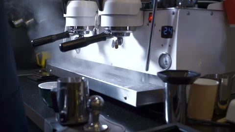 Barista makes coffee in professional machine in restaurant kitchen Spbas Stock Footage 147014811