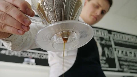 Barista makes coffee using the filter Stock Footage 75826156