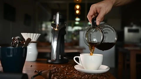 The barista makes hot drip coffee and is ready to serve in the morning. Stock Footage 254708302