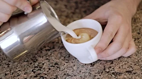 Barista makes pattern in coffee bar. Close-Up Vídeos de archivo 49631452