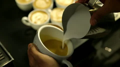 Barista makes pattern in coffee Stock Footage 22255745