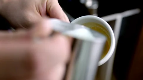 Barista makes pattern in coffee Stock Footage 66453892