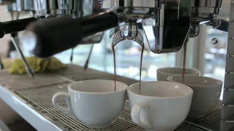 Barista makes two coffees in coffee bar Vídeos de archivo 58205536