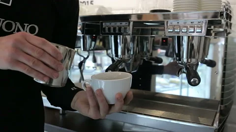 Barista makes two coffees in coffee bar Vídeos de archivo 58205556